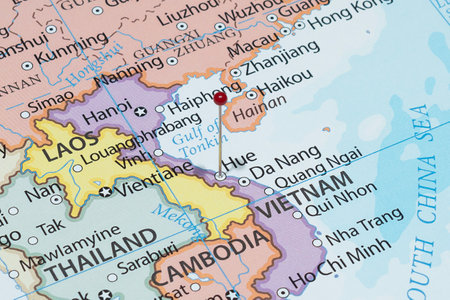 Close up to a Hue city with a red pin needle into Vietnam country political mapの写真素材