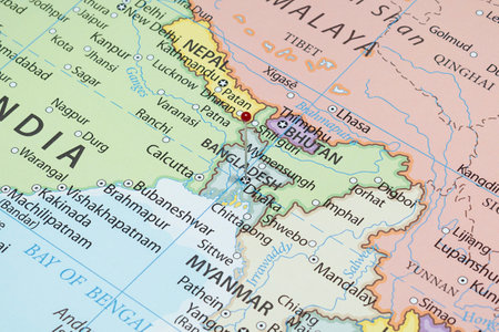 Close up to a Dhaka city with a red pin needle into Bangladesh country political mapの写真素材