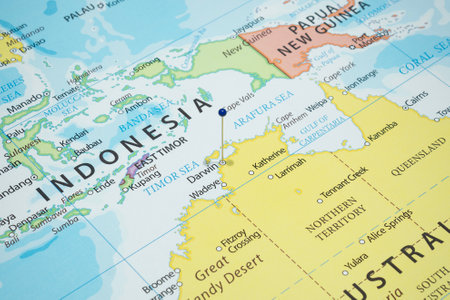 Close up to a Darwin city with a blue pin needle into Australia country political mapの写真素材