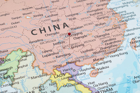 Close up to a Guiyang city with a red pin needle into China country political mapの写真素材