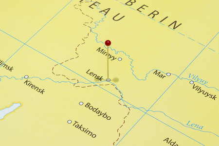 Close up to a Lensk city with a red pin needle into Russia country political mapの写真素材