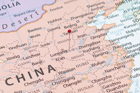 Close up to a Luoyang city with a red pin needle into China country political mapの写真素材