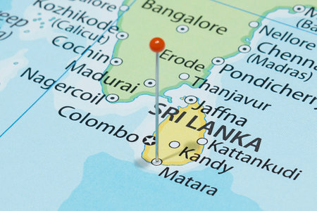 Close up to a Matara city with an orange pin needle into Sri Lanka country political mapの写真素材