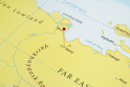 Close up to a Namy city with a red pin needle into Russia country mapの写真素材