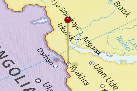 Close up to a Kyakhta city with a red pin needle into Russia country political mapの写真素材