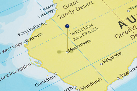 Close up to a Meekatharra city with a blue pin needle into Australia country political mapの写真素材