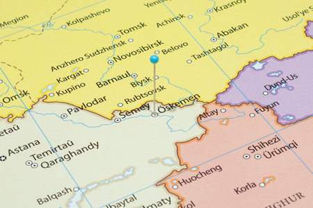 Close up to a Oskemen city with a light blue pin needle into Kazakhstan country political mapの写真素材