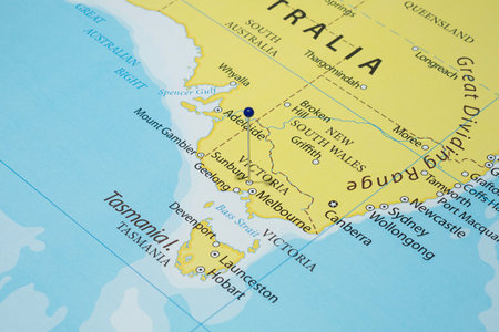 Close up to a Sunbury city with a blue pin needle into Australia country political mapの写真素材