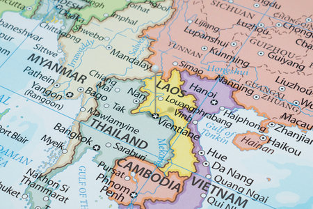 Close up to a Vientiane city with a white pin needle into Laos country political mapの写真素材