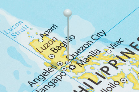 Close up to a Quezon City with a white pin needle into Philippines country political mapの写真素材