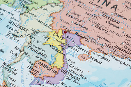 Close up to a Vinh city with a red pin needle into Vietnam country political mapの写真素材