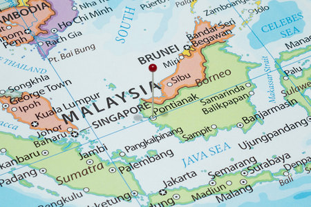 Close up to a Pontianak city with a red pin needle into Indonesia country political mapの写真素材