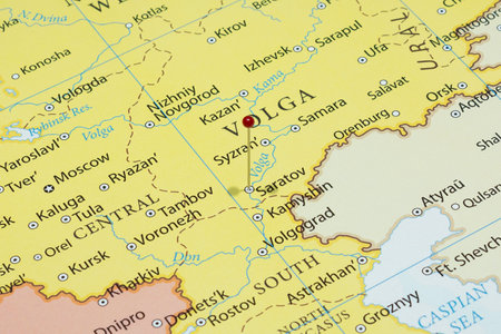 Close up to a Saratov city with a red pin needle into Russia country political mapの写真素材
