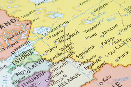 Close up to a Velikiye Luki city with a white pin needle into Russia country political mapの写真素材