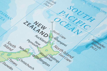 Close up to a Whangarei city with a white pin needle into New Zealand country political mapの写真素材