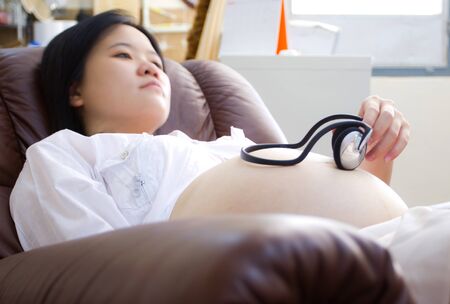 Beautiful asian pregnant woman s bellyの写真素材