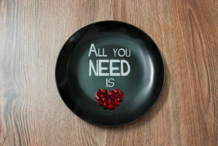 Plate with a lettering and heart symbolの写真素材