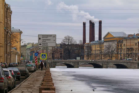 St. Petersburg, Russia - February 14, 2016: Winter view from the embankment of the Fontanka River in the Obukhov Bridge and industrial chimney.のeditorial素材