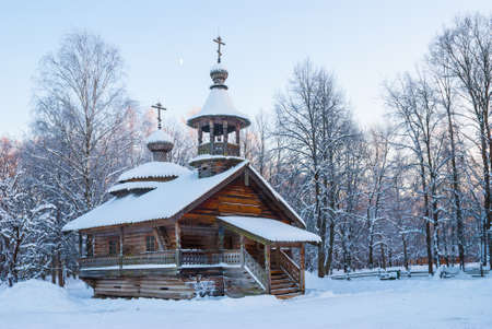 Veliky Novgorod, Russia - December 28, 2014: Wooden chapel in winter forest photographed in the Museum of Wooden Architecture called "Vitoslavlitsy"のeditorial素材