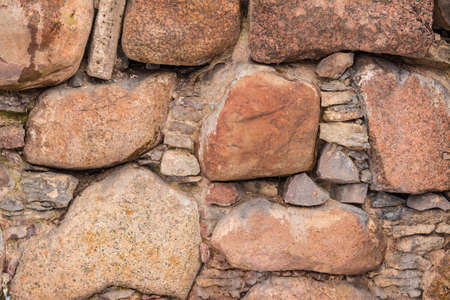 Texture of the relief stone wall closeupの写真素材