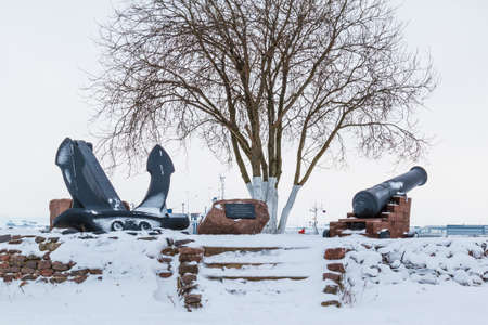 Monument to the marine defenders, an anchor and a cannon in Fort Constantine, Kronshtadt, Russiaの写真素材