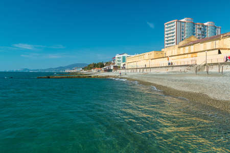 Adler, Sochi, Russia - April 1, 2016: Pebble beach with breakwaters and Black Sea in clear summer dayのeditorial素材
