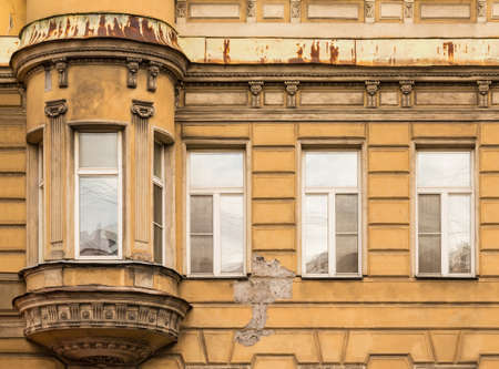 Several windows in a row and bay window on facade of urban apartment building front view, St. Petersburg, Russiaのeditorial素材