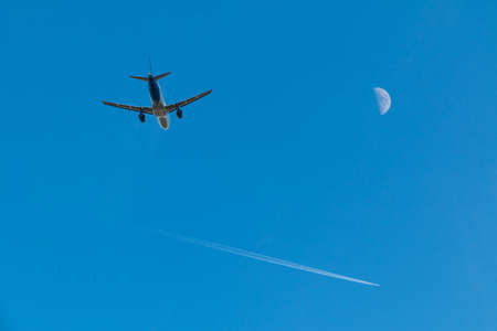 Plane taking off, plane high in the sky and moon