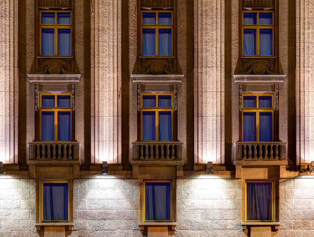 Several windows in a row on night illuminated facade of Hotel Astoria front view, St. Petersburg, Russiaの写真素材