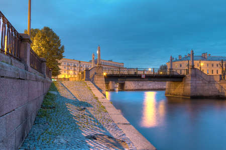 Night view on illuminated embankment of Griboedov Canal and Krasnogvardeysky Bridge, St, Petersburg, Russiaの写真素材