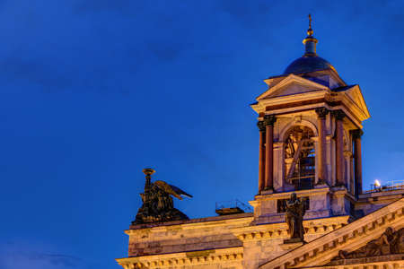 Bell tower on the corner of roof of the Saint Isaac's Cathedral on the background of the night sky, St. Petersburg, Russiaの写真素材