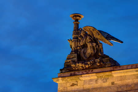 Sculpture of angel on the roof of the Saint Isaac's Cathedral on the background of night sky, St. Petersburg, Russiaの写真素材