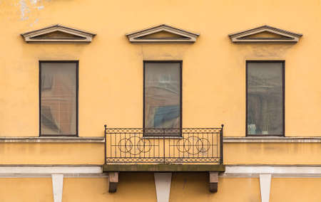 Three windows in a row and balcony on facade of the European Centre of Vaccination front view, St. Petersburg, Russiaの写真素材