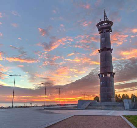 Column with weathervane on the background of sunset in the Park of the 300th anniversary of St. Petersburg, Russiaの写真素材