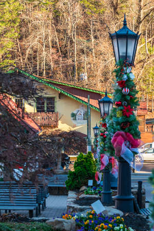 Row of decorated lampposts and view of the square and buildings, Helen, USAの写真素材