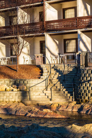 The part of facade of the hotel and stairs on the embankment of the Chattahoochee river, Helen, USAの写真素材