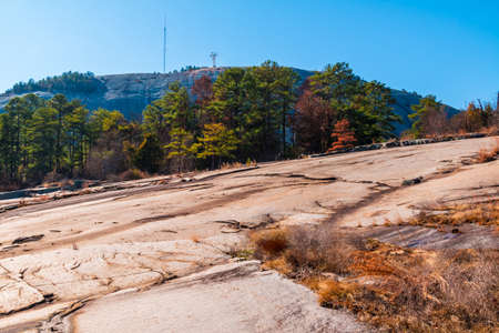 Landscape with trees and stone ground in the Stone Mountain Park in sunny autumn day, Georgia, USAの写真素材