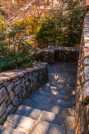 Stone stairs leading downward in the Stone Mountain Park in sunny autumn day, Georgia, USAの写真素材