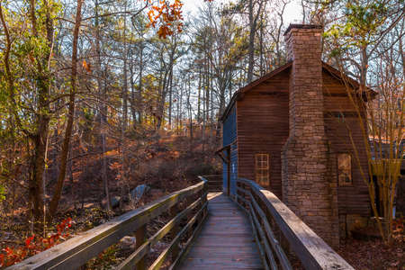 View of the Grist Mill and thicket from the bridge in the Stone Mountain Park in sunny autumn day, Georgia, USAの写真素材