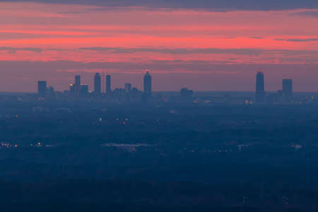 The beautiful view of Midtown Atlanta from the Stone Mountain at twilight with red sky, Georgia, USAの写真素材