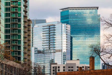Group of skyscrapers with glass facades in Midtown Atlanta in cloudy day, USAの写真素材