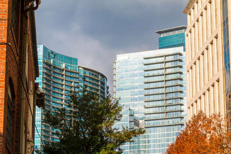 Group of skyscrapers with glass facades in Midtown Atlanta in cloudy day, USAの写真素材