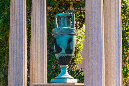 The sculpture of funeral urn and columns closeup on the Oakland Cemetery in sunny autumn day, Atlanta, USAの写真素材