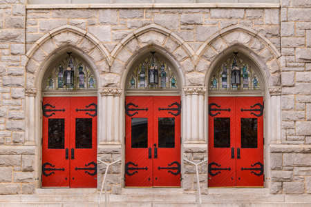 Three doors in a row on the facade of Saint Mark United Methodist Church front view, Atlanta, USAの写真素材