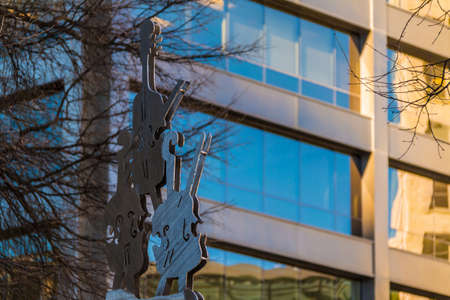 Sculpture of bowed string instruments on the background of the office building, Atlanta, USAの写真素材