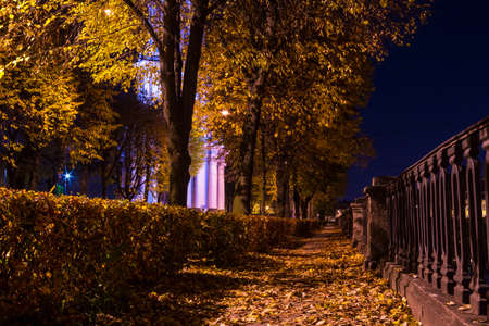 Night autumn low angle view of embankment of Kryukov Canal and illuminated St. Nicholas Naval Cathedral, Saint Petersburg, Russiaの写真素材