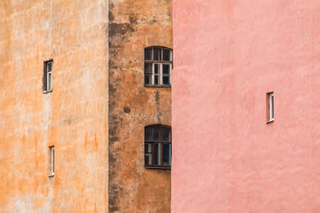 Several windows located on facades of two different urban apartment buildings chaotically, St. Petersburg, Russiaの写真素材
