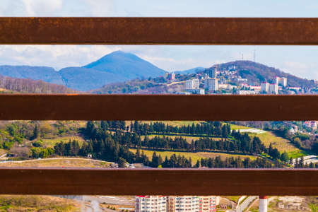 Aerial view of Sochi seen through the iron fence in sunny day, Russiaの写真素材
