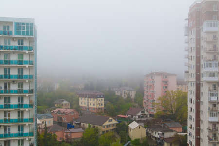 Aerial view of apartment buildings in the morning fog, Sochi, Russiaの写真素材
