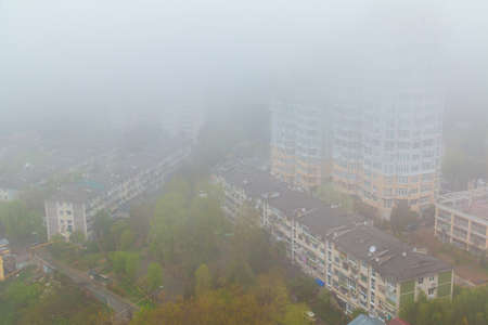 Aerial view of apartment buildings in the morning fog, Sochi, Russiaの写真素材